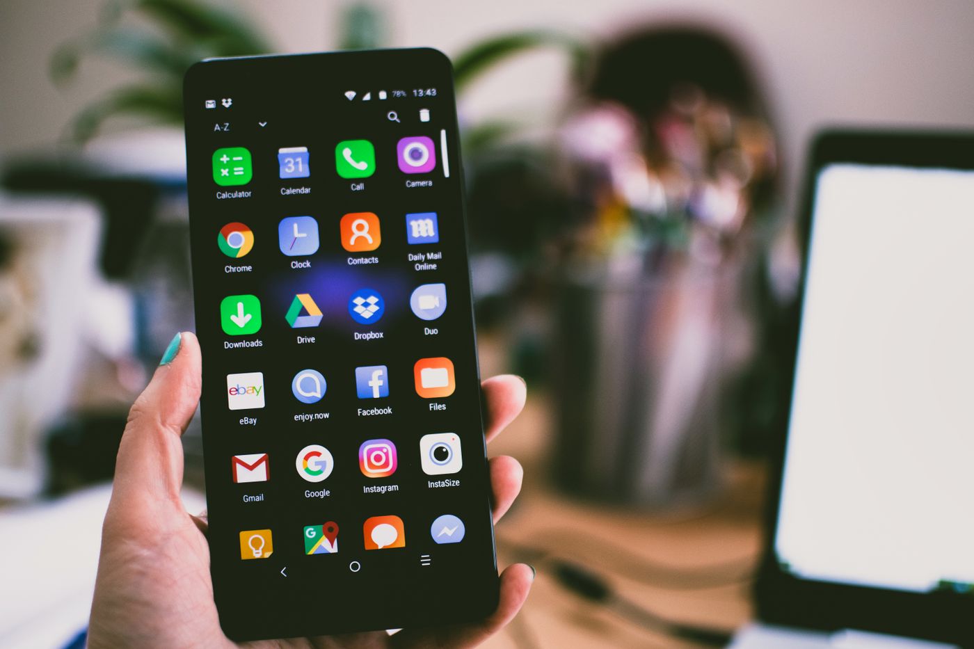 Person using smart home app on smartphone